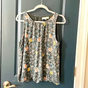 Sleeveless floral/eyelet blouse